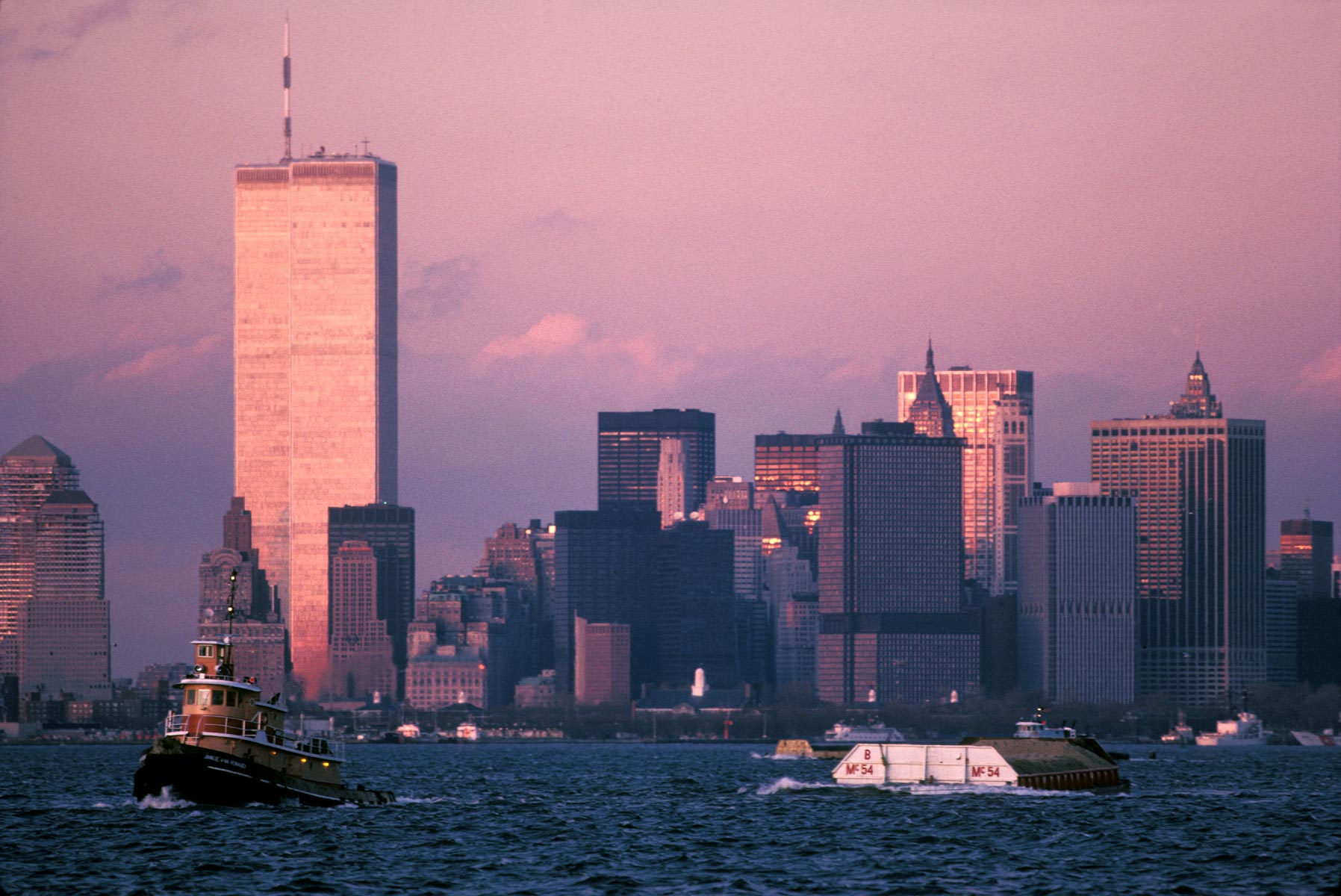 "Tug Pulling Barge"  <br>   World Trade Center in Background, NYC