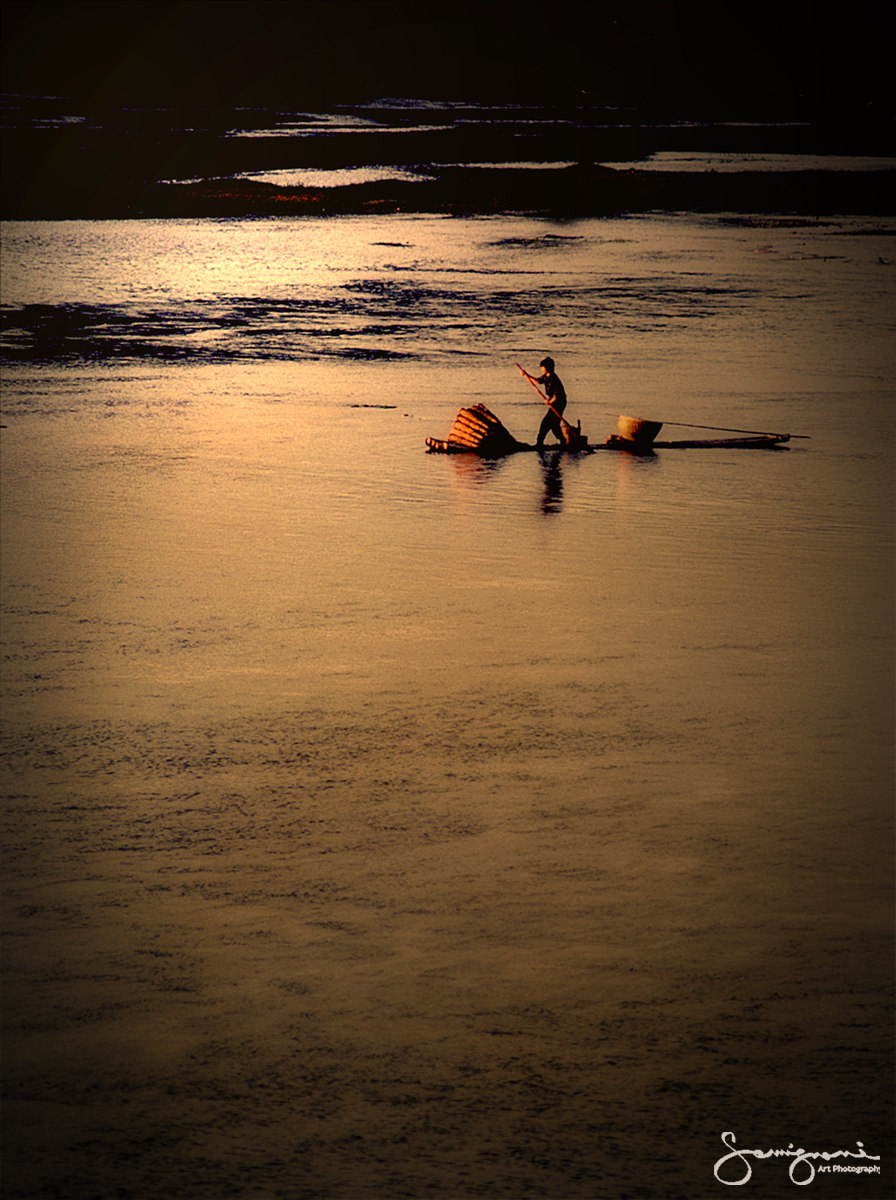 Fighting the current in a Bamboo Boat- China